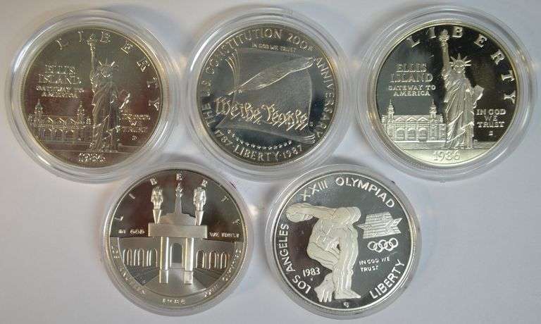 Lot of 5 1983 to 1987 Commemorative Silver Dollars in original capsules
