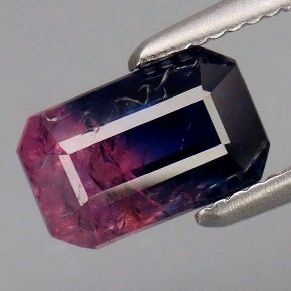 Holy cow! It's a 1.38ct pink and blue Sapphire! And it's HEATED ONLY!