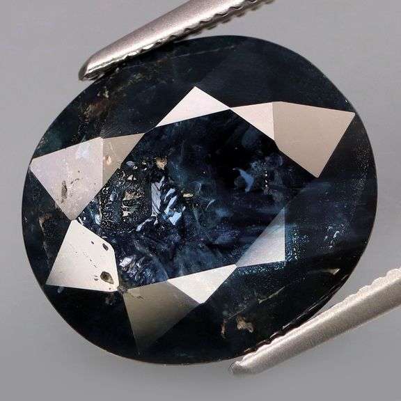 Woah! This 8.70ct Sapphire is midnight blue with silver sparkles!