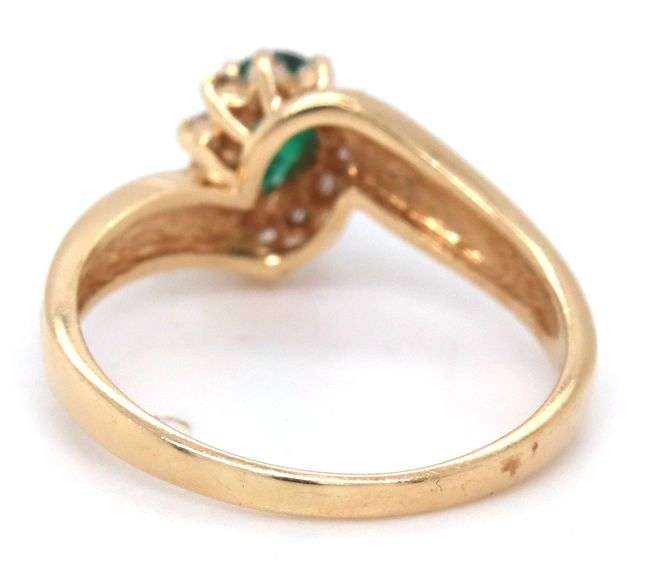 Feminine 14k Yellow Gold Ring with Pear Shaped Emerald