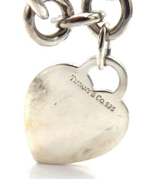 Tiffany & Co link bracelet with heart shaped charm