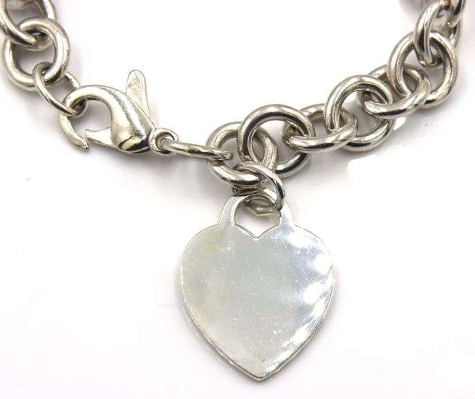Tiffany & Co link bracelet with heart shaped charm