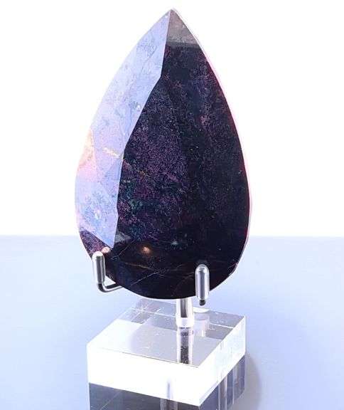 Holy cow! It's a 1,374ct Ruby in Matrix! With a stand!