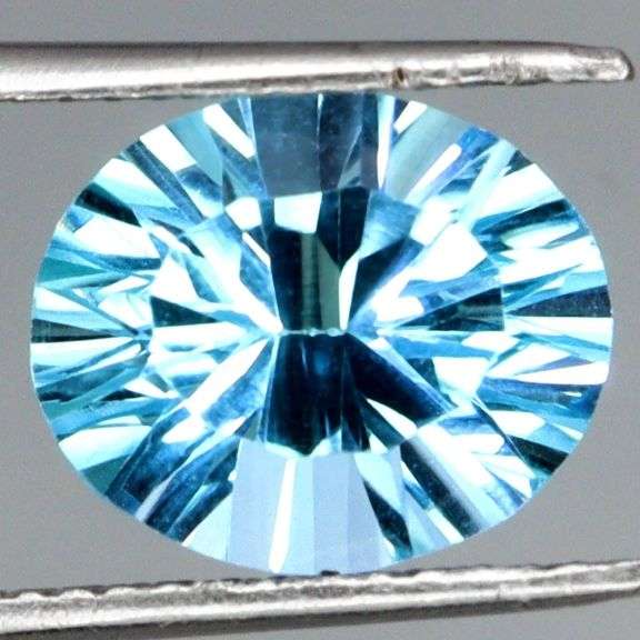 Fiery! Non-stop full body flashing 8.66ct concave cut Topaz!