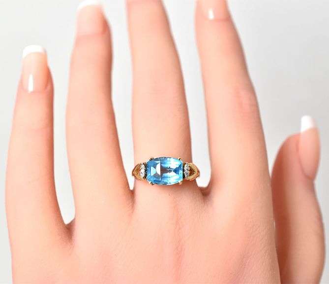 Elegant 10K Yellow Gold Blue Topaz Gemstone Ring with Diamond Accents