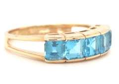 14kt Yellow gold channel set princess cut blue topaz five stone band