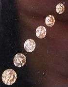 Graduated! 6 piece set of champagne diamonds weighing .44 carats!