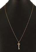Tiffany & Co. 0.15ctw Diamond Vintage Oval Key Pendant Necklace in 18K