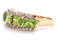14kt Yellow gold East West emerald cut peridot and diamond 4 stone ring