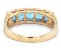 14kt Yellow gold channel set princess cut blue topaz five stone band