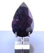Holy cow! It's a 1,374ct Ruby in Matrix! With a stand!