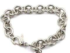 Tiffany & Co link bracelet with heart shaped charm