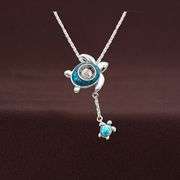 Beautiful "turtle with baby" silver and dancing moissanite necklace
