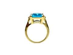 Breathtaking 14 kt Yellow Gold Plate 6.5 Ct Emerald Cut Simulated Swiss Blue Topaz Ring