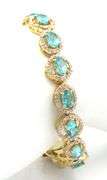 Mesmerizing 11.80CTW Oval Shaped Faceted Apatite & 2.10CTW Diamond Bracelet in 14K Yellow Gold Over 