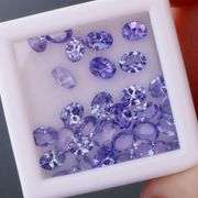 Glittering 5.59ct UNTREATED oval cut Tanzanite set