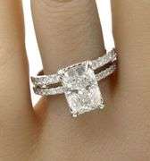 18kt White gold 2.55ct Cushion cut lab grown and 0.55ctw diamond under halo wedding set