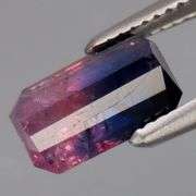 Holy cow! It's a 1.38ct pink and blue Sapphire! And it's HEATED ONLY!