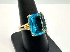 Breathtaking 14 kt Yellow Gold Plate 6.5 Ct Emerald Cut Simulated Swiss Blue Topaz Ring