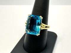 Breathtaking 14 kt Yellow Gold Plate 6.5 Ct Emerald Cut Simulated Swiss Blue Topaz Ring