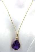 14kt Yellow gold pear shaped amethyst and bezel set diamond enhancer pendant on chain