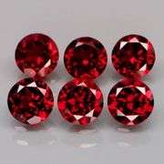 LOOK! It’s a whole set of Mozambique Garnet solitaires! 8.95 carats of them!