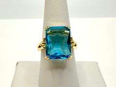 Breathtaking 14 kt Yellow Gold Plate 6.5 Ct Emerald Cut Simulated Swiss Blue Topaz Ring