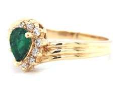 Feminine 14k Yellow Gold Ring with Pear Shaped Emerald