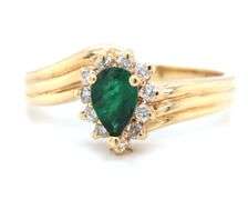 Feminine 14k Yellow Gold Ring with Pear Shaped Emerald