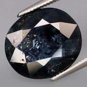 Woah! This 8.70ct Sapphire is midnight blue with silver sparkles!