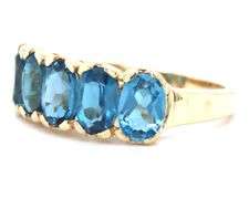 10kt Yellow gold oval blue topaz 5 stone ring