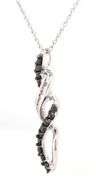 10kt White gold black and white diamond twisted pendant on chain