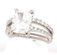 18kt White gold 2.55ct Cushion cut lab grown and 0.55ctw diamond under halo wedding set