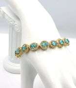 Mesmerizing 11.80CTW Oval Shaped Faceted Apatite & 2.10CTW Diamond Bracelet in 14K Yellow Gold Over 