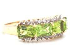 14kt Yellow gold East West emerald cut peridot and diamond 4 stone ring