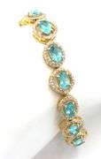 Mesmerizing 11.80CTW Oval Shaped Faceted Apatite & 2.10CTW Diamond Bracelet in 14K Yellow Gold Over 