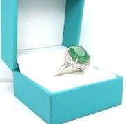 Sparkling 8.63CTS Oval Faceted Emerald & 1.11CTW White Sapphire Ring in Sterling Silver