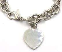 Tiffany & Co link bracelet with heart shaped charm