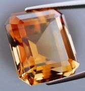 Electric flashing through rich color! Huge 34.99ct Imperial Topaz!