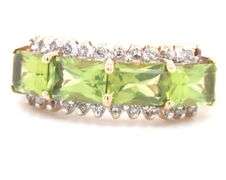 14kt Yellow gold East West emerald cut peridot and diamond 4 stone ring