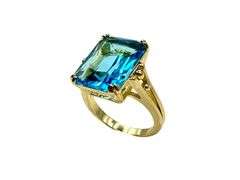 Breathtaking 14 kt Yellow Gold Plate 6.5 Ct Emerald Cut Simulated Swiss Blue Topaz Ring