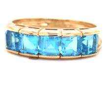 14kt Yellow gold channel set princess cut blue topaz five stone band