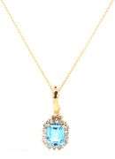 14kt Yellow gold Emerald cut blue topaz and diamond halo enhancer pendant on chain