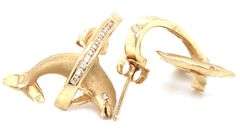 14kt Yellow gold 0.35ctw diamond dolphin jumping through hoop earrings