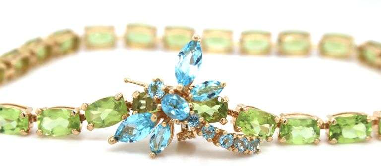 14kt Yellow gold oval peridot bracelet with blue topaz dragonfly
