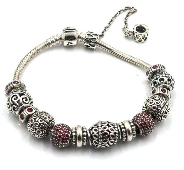 Pandora bracelet with red charms