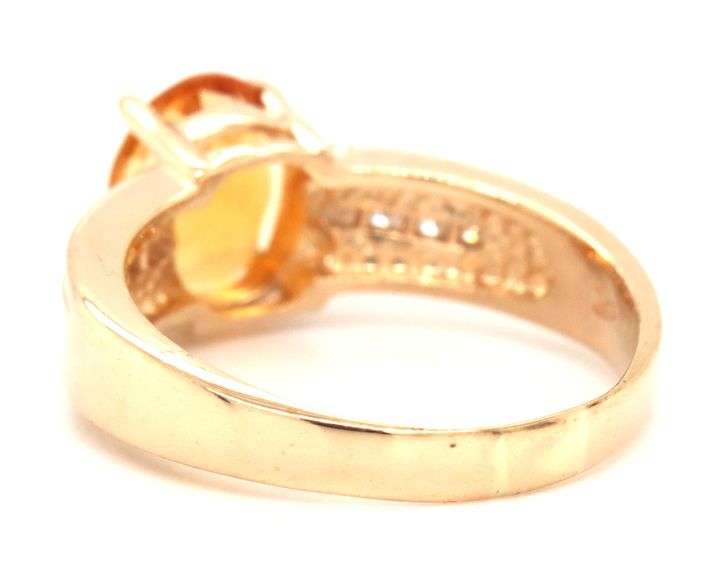 14kt Yellow gold oval citrine and channel set diamond ring