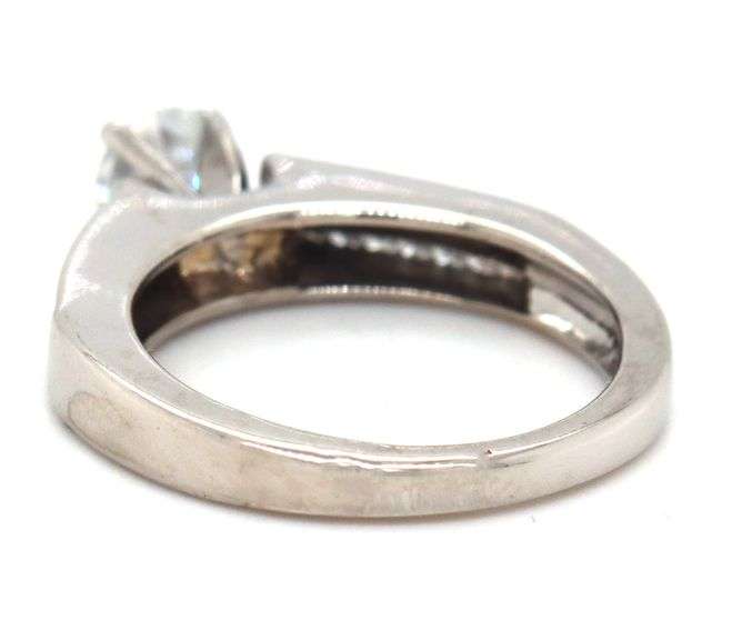14kt White gold RBC diamond and princess cut Invisible set ring