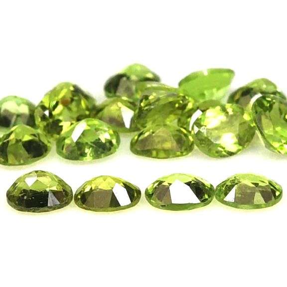 Dazzling 8.71ct untreated apple green Peridot set