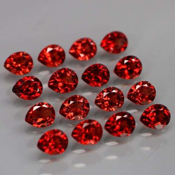 Outstanding 6.62ct pear cut high fire Mozambique Garnet set